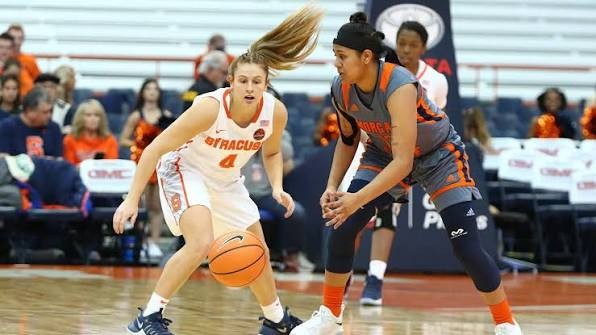 Naomi Bolasingh guarding a Syracuse ball handler during a college game